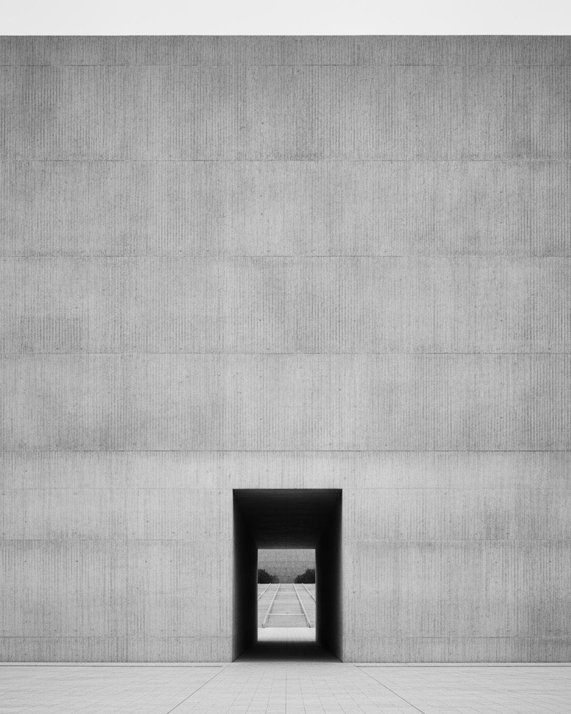 Foundry Arts — a monumental board-formed-concrete cultural building with a single recessed entry